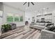 Well-lit living room with ample windows, wood floors, and open concept design perfect for entertaining at 536 Rustlewood Way, Rock Hill, SC 29732