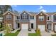 Charming townhome exterior with a brick and siding facade, well-manicured lawn, and private garage at 6161 Helens Rest Ln, Lincolnton, NC 28092