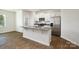 Modern kitchen features white cabinets, stainless steel appliances, granite countertops, and a kitchen island at 6161 Helens Rest Ln, Lincolnton, NC 28092