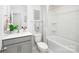 Cozy bathroom showcasing a tub and shower, with stylish gray vanity and modern fixtures at 6165 Helens Rest Ln, Lincolnton, NC 28092