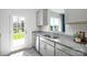 Bright kitchen features stainless steel appliances, granite countertops, and a backyard view at 6165 Helens Rest Ln, Lincolnton, NC 28092