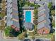 Aerial view of a community featuring a pool, clubhouse, and mature landscaping at 6231 Wakehurst Rd, Charlotte, NC 28226