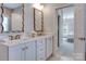 Elegant bathroom featuring double sinks and a vanity at 6231 Wakehurst Rd, Charlotte, NC 28226