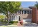 Charming brick two-story home with a bay window, attached garage, and mature landscaping at 6231 Wakehurst Rd, Charlotte, NC 28226