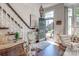 Inviting foyer with hardwood floors, a staircase, and an open view to the front door at 6231 Wakehurst Rd, Charlotte, NC 28226