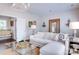 Bright living room featuring a plush white sofa and stylish decor at 6231 Wakehurst Rd, Charlotte, NC 28226