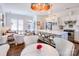 Open-concept living area featuring a kitchen island, dining table, and comfortable seating at 6231 Wakehurst Rd, Charlotte, NC 28226