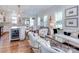 Open living space featuring a kitchen island, comfortable seating, and ample natural light at 6231 Wakehurst Rd, Charlotte, NC 28226