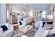 Bright open concept featuring a kitchen island, stainless appliances, and adjacent living room at 6231 Wakehurst Rd, Charlotte, NC 28226