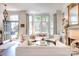 Sophisticated living room showcasing a fireplace, bay window, and stylish furniture arrangement at 6231 Wakehurst Rd, Charlotte, NC 28226