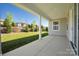 Covered back patio with view of the yard and surrounding homes at 6272 Raven Rock Dr, Denver, NC 28037