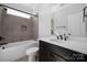 Bathroom with a white vanity, dark fixtures, tub, and tiled shower at 6272 Raven Rock Dr, Denver, NC 28037