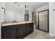 Bathroom featuring a double vanity with granite countertops and a glass-enclosed shower at 6272 Raven Rock Dr, Denver, NC 28037