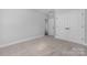 Simple bedroom with gray carpet, white walls, trim, and a closet at 6272 Raven Rock Dr, Denver, NC 28037
