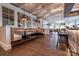 Modern dining area with booth seating, decorative lighting, and stylish tables in a vibrant setting at 6272 Raven Rock Dr, Denver, NC 28037