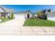 Inviting single-story home featuring manicured lawn, stone accents, and a convenient two-car garage at 6272 Raven Rock Dr, Denver, NC 28037