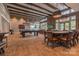 Spacious game room with a poker table, pool table, ample seating, and natural light at 6272 Raven Rock Dr, Denver, NC 28037
