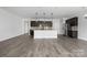 Open-concept kitchen featuring an island with pendant lighting and stainless steel appliances at 6272 Raven Rock Dr, Denver, NC 28037
