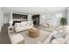 Bright and airy living room showcasing modern furnishings, open layout, and seamless flow to the kitchen at 6272 Raven Rock Dr, Denver, NC 28037