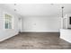Empty living room with wood flooring and a large window at 6272 Raven Rock Dr, Denver, NC 28037