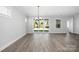 Bright living room with wood flooring and sliding glass doors to backyard at 6272 Raven Rock Dr, Denver, NC 28037