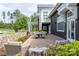 Charming outdoor patio with wicker seating and dining table, perfect for entertaining guests at 6272 Raven Rock Dr, Denver, NC 28037