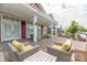Spacious outdoor patio area with ample seating and a pergola, ideal for enjoying the outdoors at 6272 Raven Rock Dr, Denver, NC 28037