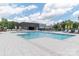 Outdoor pool area with lounge chairs, umbrellas, and plenty of space for recreation at 6272 Raven Rock Dr, Denver, NC 28037