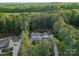 Aerial view of an estate surrounded by mature forest at 7351 Bay Cove Ct, Denver, NC 28037