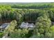 Aerial view of an estate surrounded by mature forest at 7351 Bay Cove Ct, Denver, NC 28037