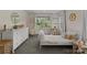 Stylish bedroom featuring a hanging chair, dollhouse and dresser complemented by a playful and cozy decor at 7351 Bay Cove Ct, Denver, NC 28037
