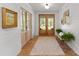 Inviting foyer with hardwood floors, shiplap walls, and natural light at 7351 Bay Cove Ct, Denver, NC 28037
