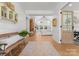Open-concept foyer flows into a living area with a fireplace and ample natural light at 7351 Bay Cove Ct, Denver, NC 28037