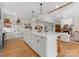 Open-concept kitchen with an island, modern appliances, and seamless flow to the living room at 7351 Bay Cove Ct, Denver, NC 28037
