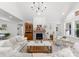 Spacious living room with vaulted ceiling, brick fireplace, and stylish decor at 7351 Bay Cove Ct, Denver, NC 28037