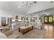 Open floor plan reveals a spacious living area seamlessly connecting to the kitchen and gallery wall at 7351 Bay Cove Ct, Denver, NC 28037