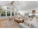 Expansive living room with vaulted ceilings flows into a well-equipped kitchen at 7351 Bay Cove Ct, Denver, NC 28037