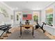 Bright home office with natural light, modern desk setup, and exercise equipment at 7351 Bay Cove Ct, Denver, NC 28037