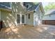 Wooden deck with access to the home's interior through glass doors and a view of the private backyard at 741 Bermuda Ave, Gastonia, NC 28054