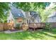 Charming home featuring a spacious wooden deck and a well-maintained yard with privacy fence at 741 Bermuda Ave, Gastonia, NC 28054