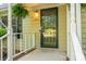 Inviting front porch with hanging fern, black door, and siding with the house number 741 visible at 741 Bermuda Ave, Gastonia, NC 28054