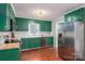 Bright kitchen with vibrant cabinetry, stainless steel appliances, wood countertops, and modern fixtures at 741 Bermuda Ave, Gastonia, NC 28054