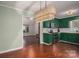Inviting kitchen features vibrant cabinetry, wood countertops, stainless steel appliances, and decorative wicker light fixture at 741 Bermuda Ave, Gastonia, NC 28054
