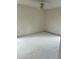 Spacious bedroom with a ceiling fan and primed walls ready for paint at 7505 Conifer Cir, Indian Trail, NC 28079