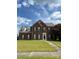 Charming two-story brick home with a well-manicured lawn and inviting entrance at 7505 Conifer Cir, Indian Trail, NC 28079