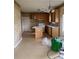 Kitchen with wood cabinets and an island, with work to be done at 7505 Conifer Cir, Indian Trail, NC 28079