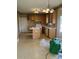 View of a kitchen with wood cabinets and an island, ready for renovation at 7505 Conifer Cir, Indian Trail, NC 28079