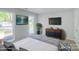 Comfortable bedroom filled with natural light, featuring calming colors and modern accents for a relaxing retreat at 7810 Trotter Rd, Charlotte, NC 28216