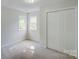 Well-lit bedroom featuring a double window view and built-in closet, suitable for all your needs at 7810 Trotter Rd, Charlotte, NC 28216