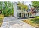 Charming two-story home with black shutters, inviting front porch, and well-manicured lawn at 7810 Trotter Rd, Charlotte, NC 28216